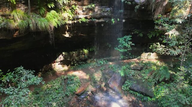 NSW, Australia: UHD Drone Video &ndash;Raising along the beautiful Junction Falls and above the gum trees canopy at the 5 Waterfalls Circuit walking track in South Lawson in Blue Mountains.