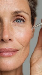 Beautiful 50s mid aged mature woman looking at camera isolated. Mature old lady close-up portrait. Healthy face skin care, middle age skincare cosmetics, cosmetology concept