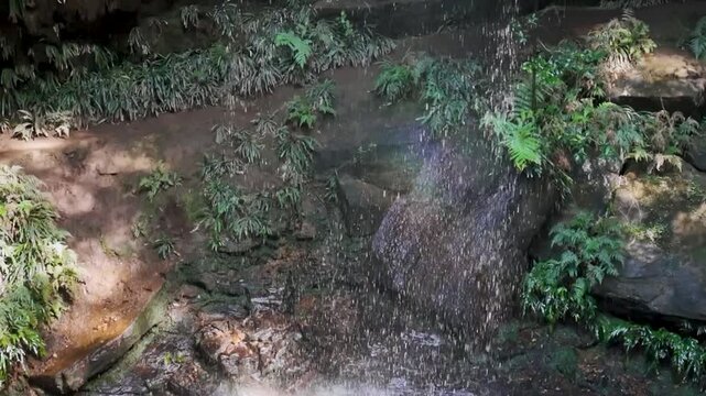 Blue Mountains, NSW, Australia: HD Drone Video -Close up with a rainbow to the beautiful Junction Falls in Australian rainforest on the South Lawson's 5 Waterfalls Circuit walking track.