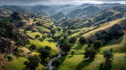 Verdant Valley Aerial View of Rolling Hills  River Under a Cloudy Sky.