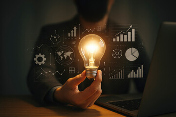 Glowing lightbulb held by hand with digital data visualization innovation technology