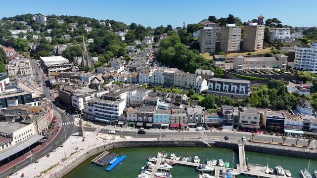 Pull-back aerial view of Torquay Marina in Torquay town in Devon, south west England on a sunny day