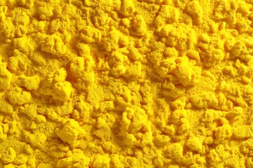 A vibrant yellow sponge texture background, ideal for creating a colorful and energetic backdrop, featuring vivid textures and patterns.