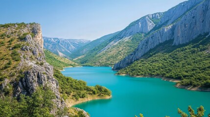 Scenic view of a lake with turquoise water surrounded by mountains