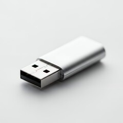 Silver USB drive on a white background, minimalist design, concept for data storage, technology innovation and digital portability
