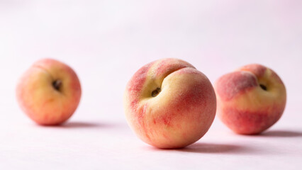 Fresh peaches on pink background, Summer fruit