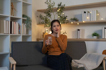 Hydration and Health. Woman drinking water at home.