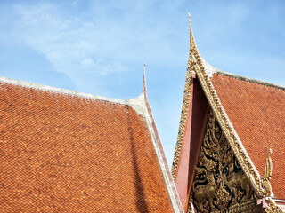 Vintage Thai Traditional Church Roof with Blue Sky.