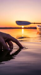 Touching Water at Sunset: Hand Creates Ripples on Calm Lake Surface