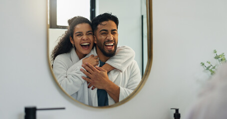 Couple, hug and laugh by mirror in bathroom for skincare, hygiene and happy together. Home, man and...