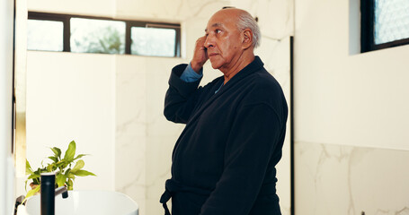 Elderly man, comb and brush hair in bathroom for beauty, healthy growth and grooming routine....