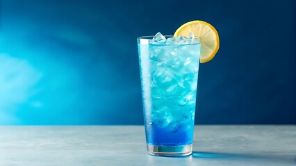 Refreshing blue cocktail with ice and a lemon slice in a tall glass against a gradient blue background perfect for summer drinks and parties