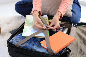 Female Young Woman Packing SUitcase for Vacation