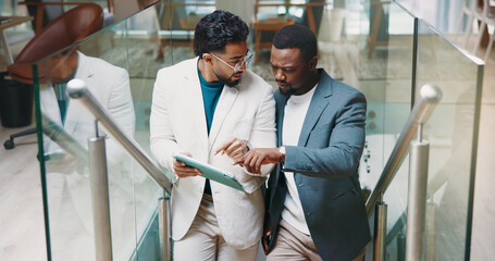 Talk, stairs or business people with tablet for review, investment feedback and budget....