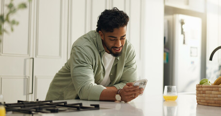 Home, smile and man in kitchen, cellphone and typing with social media, internet and texting....