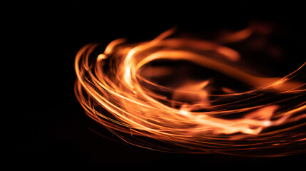 A photo of abstract fire flames gently swirling in a black background during night