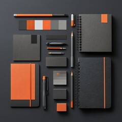 Assorted stationery items in black and orange
