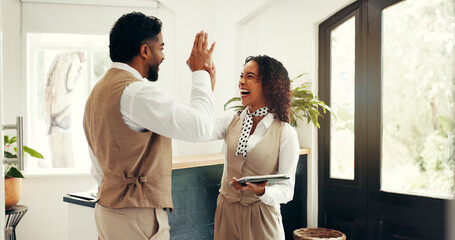 High five, online booking and tablet with hotel concierge staff in lobby together for celebration....