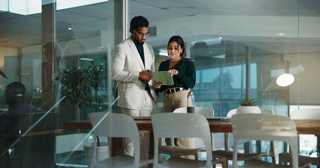 People, meeting and tablet in office at night for accounting, financial planning and review budget....