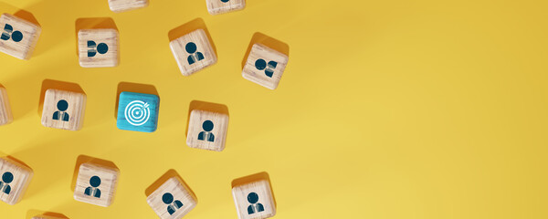 One blue wooden cube with a white target icon standing out among business team icons on wooden...