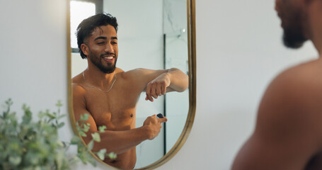 Mirror, happy and man with deodorant in bathroom for fresh scent, grooming and hygiene in home....