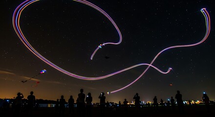 Night Sky Canvas Light Painting with Drone Trails above Crowd