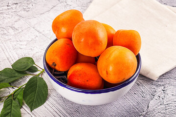 Raw ripe sweet apricots heap