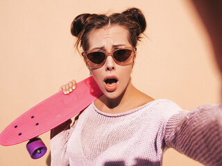 Young beautiful sexy smiling hipster woman in sunglasses.Trendy female in summer knitted...