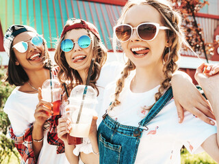Three young beautiful smiling hipster female in trendy summer clothes.Sexy carefree women posing...