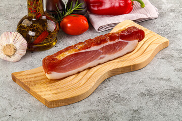 Piece prosciutto crudo over board