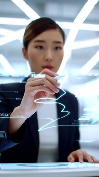 A top-down, high-angle medium video shows a neutral hand tracing an illuminated path on a digital interface, displaying a strategic roadmap on a minimalist desk in a modern high-tech office. Soft