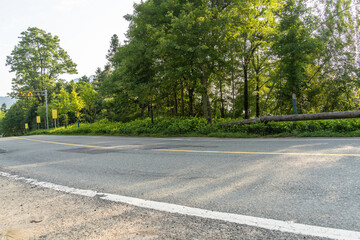 empty asphalt through mountain as background