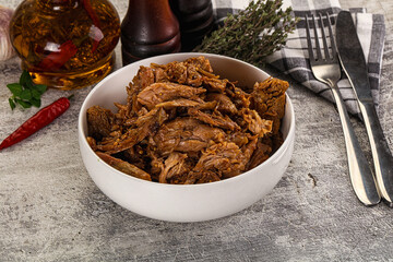 Shredded slow cooked pork meat