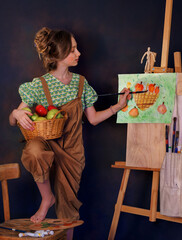 Child girl or artist with easel and palette painting at studio, plein air. Talented little artist smiles and prepares to draw on canvas with paint brush. Art preschool, creativity and people concept
