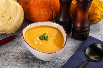 Vegan pumpkin cream soup served sesam