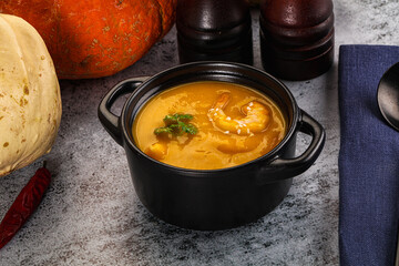 Pumpkin cream soup with prawns