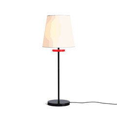 Minimalist black and white lamp with red accent on white background, modern decor