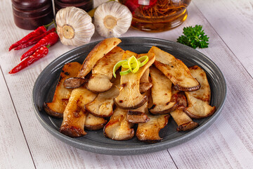 Roasted eringi mushrooms in the plate