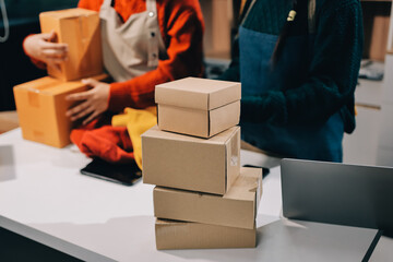 Portrait of Starting small businesses SME owners, two Asian woman check online orders Selling...