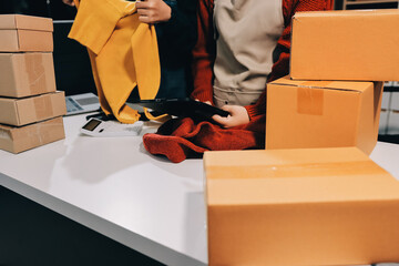 Portrait of Starting small businesses SME owners, two Asian woman check online orders Selling...