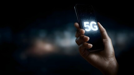 Hand holding a smartphone displaying the 5G symbol