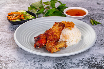 Spicy roasted chicken wing with rice