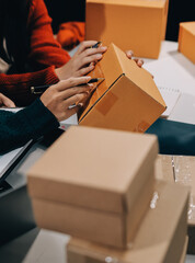 Portrait of Starting small businesses SME owners, two Asian woman check online orders Selling...