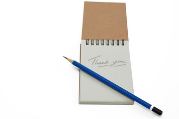 Creative Notepad With a Handwritten Thank You Note and a Blue Pencil on a Clean Background
