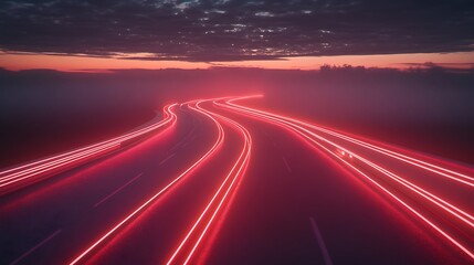 Obraz premium Winding highway at sunset with illuminated trails