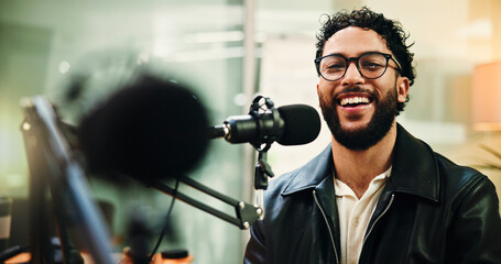 Mic, laughing and man in studio for podcast, recording broadcast and talking for radio show. Media...