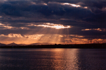 picture of sun rays passing through storm clouds