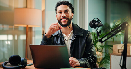 Happy, laptop and portrait of man with mic for broadcast, talk show and host interview. Night, content creation and influencer on computer with online questions for podcast, script and digital notes