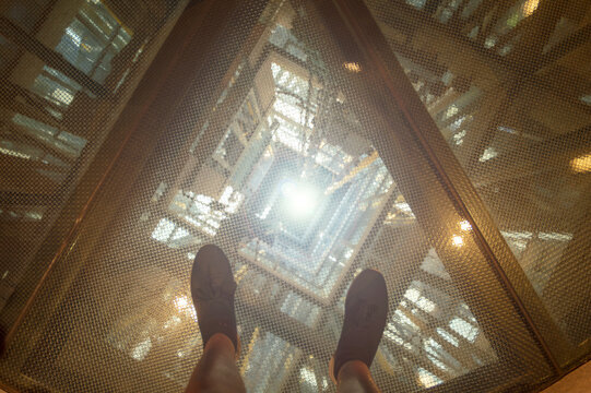 image of an elevator shaft seen from above on safety glass