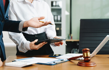 business people and lawyers discussing contract papers sitting at the table. Concepts of law,...